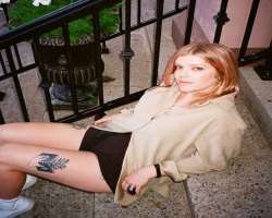 Milner has tattoos on her both thighs.